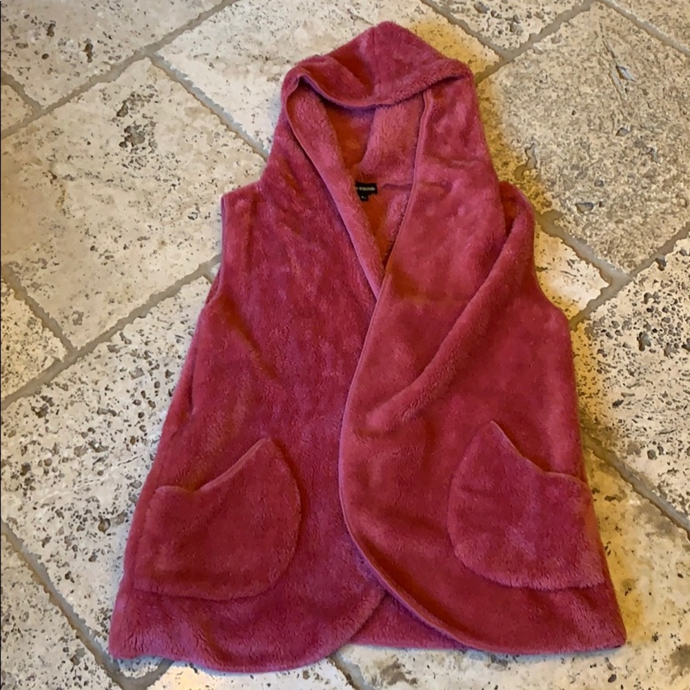 Hip length, pocketed, pink Sherpa vest.